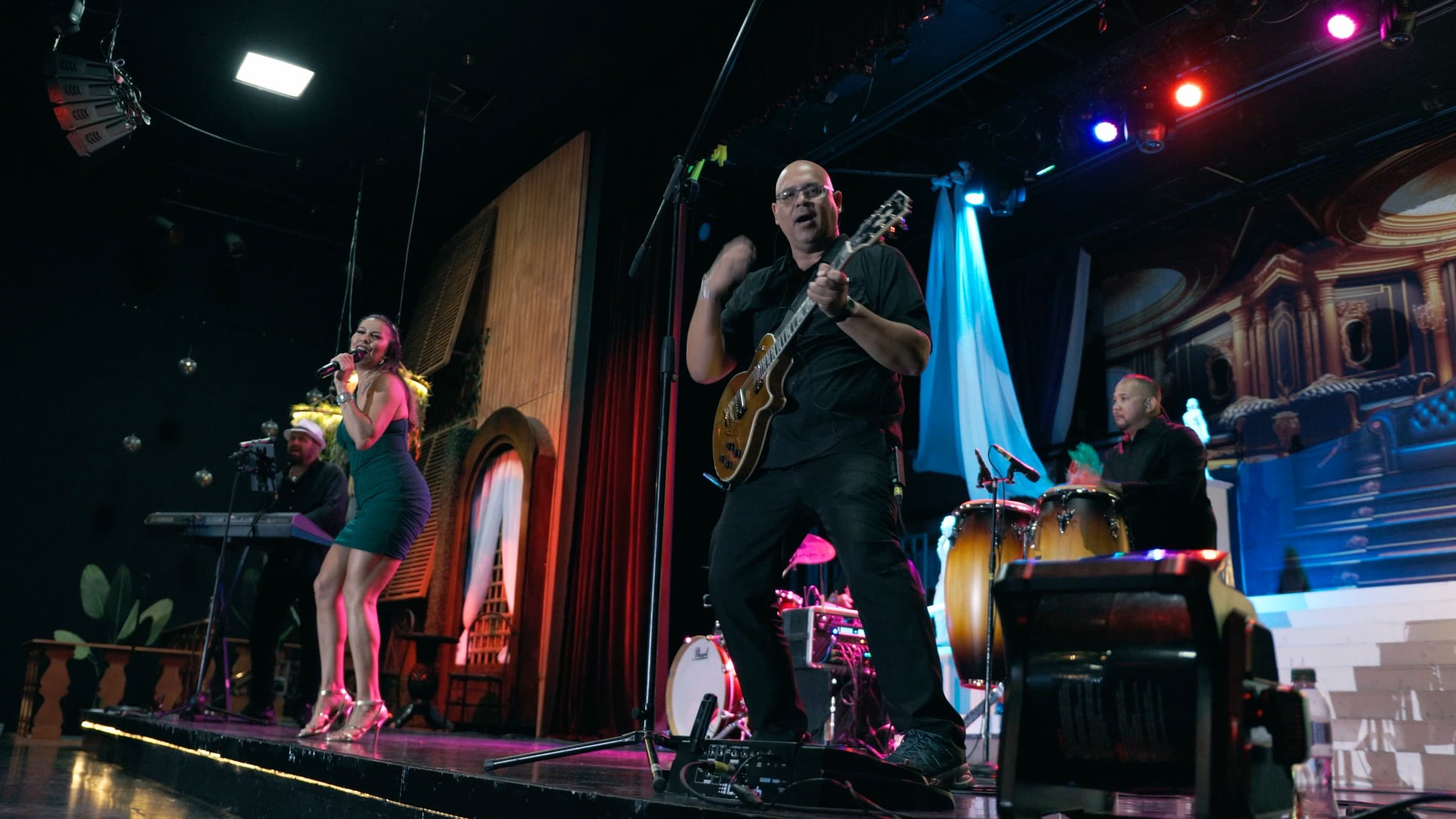 Astra live band performing on a theater stage in Aruba
